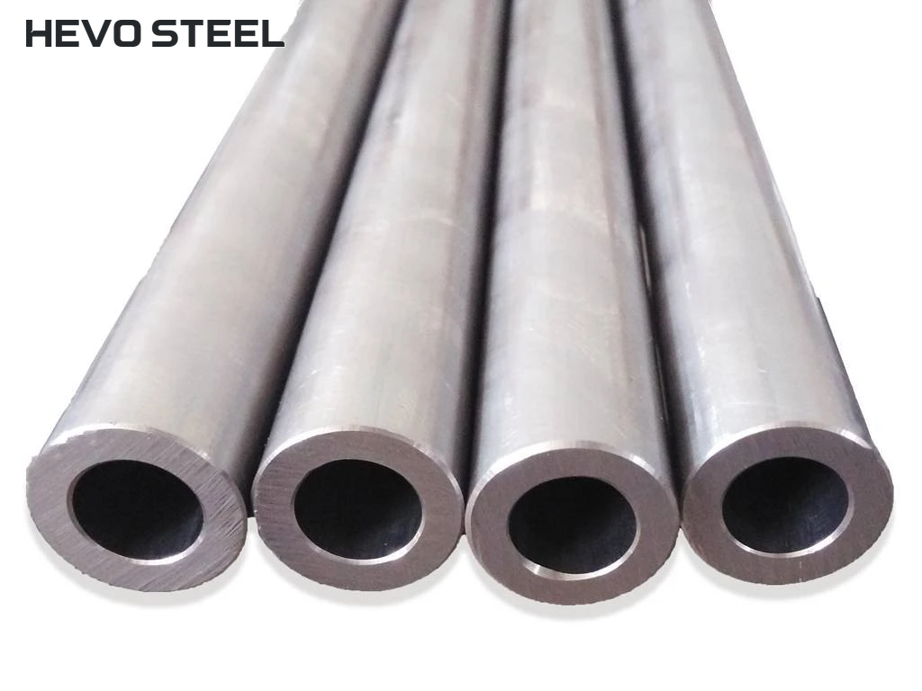 Four thick-walled round tube sections with open ends and walls visible.