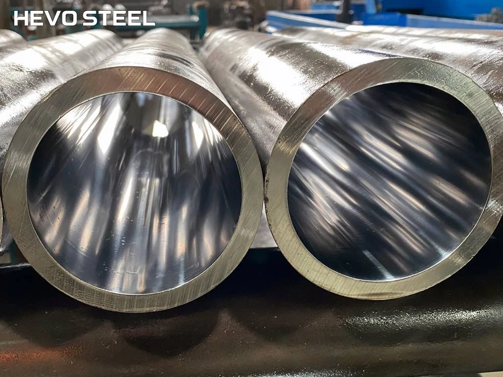 Close view of two open tube ends and their reflective internal surfaces.
