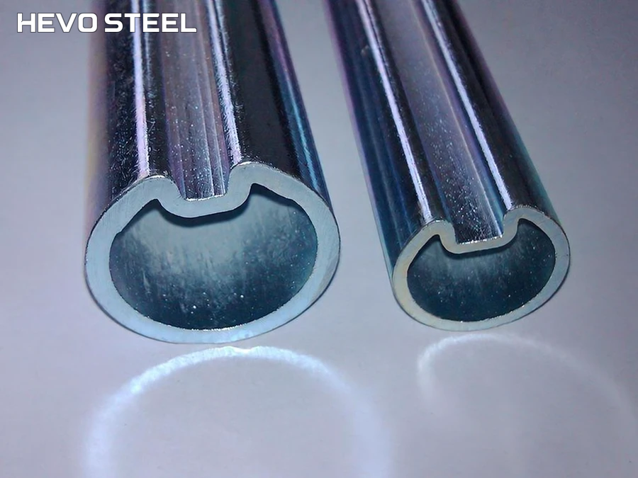 Two hollow tubes with inward-formed grooves, showing the ends and surrounding walls.