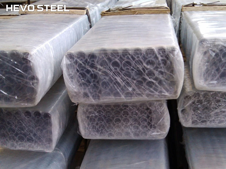Bundles of grooved hollow tubes with protective wrapping around their ends.